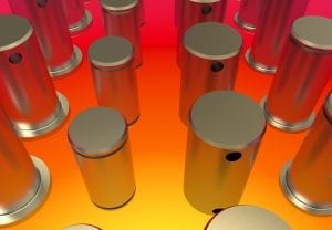A group of cylinders in the middle of an orange room.