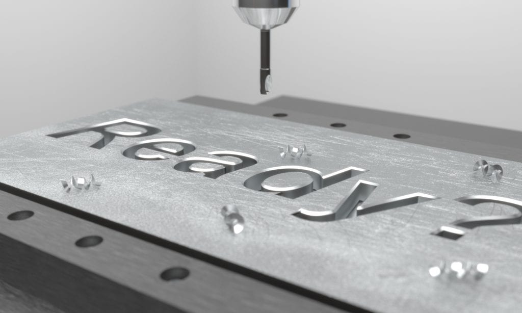 CNC mill engraving the word "Ready" into a metal plate